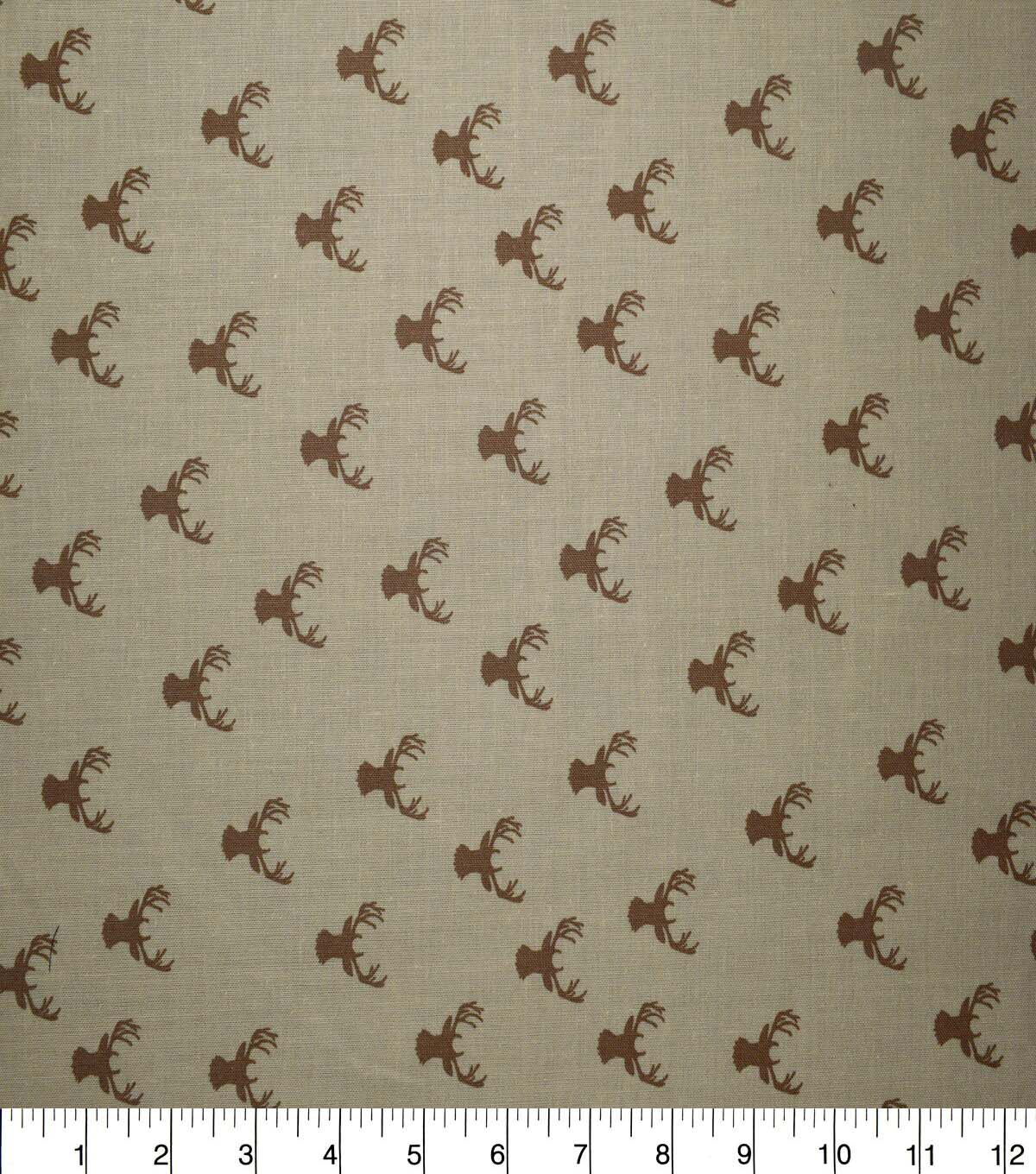 In the Wild Stag Heads on Brown Cotton Fabric by Quilter's Showcase