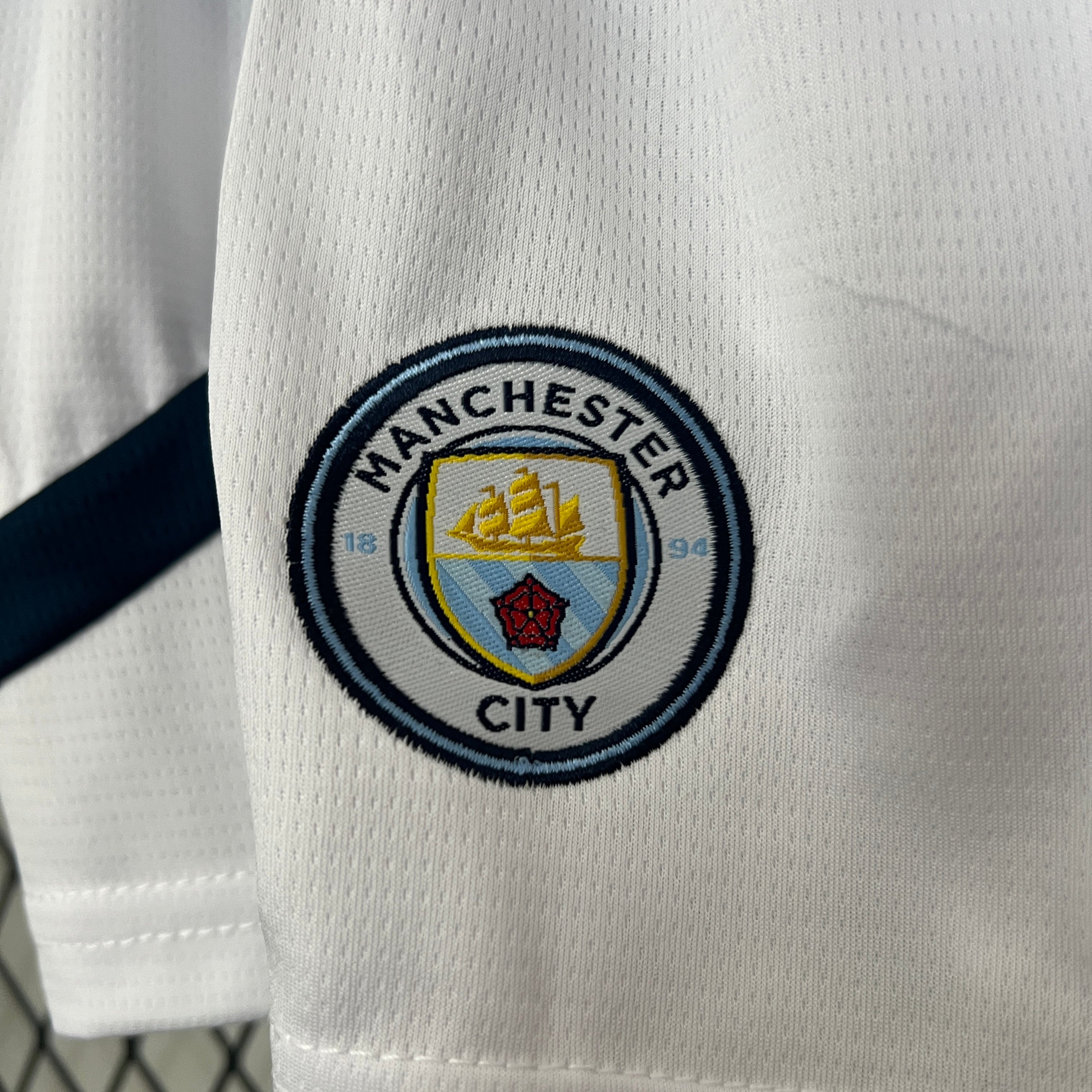 KIT INFANTIL DO MANCHESTER CITY 24/25 PRINCIPAL