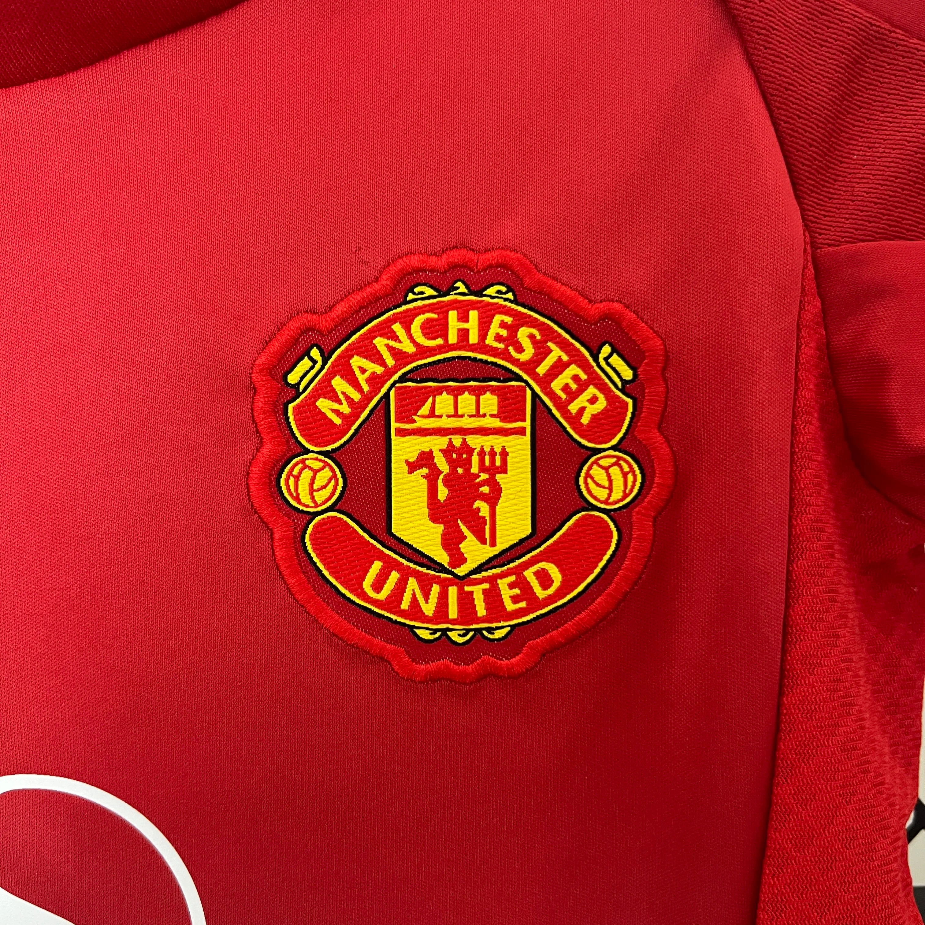 KIT INFANTIL DO MANCHESTER UNITED 24/25 PRINCIPAL