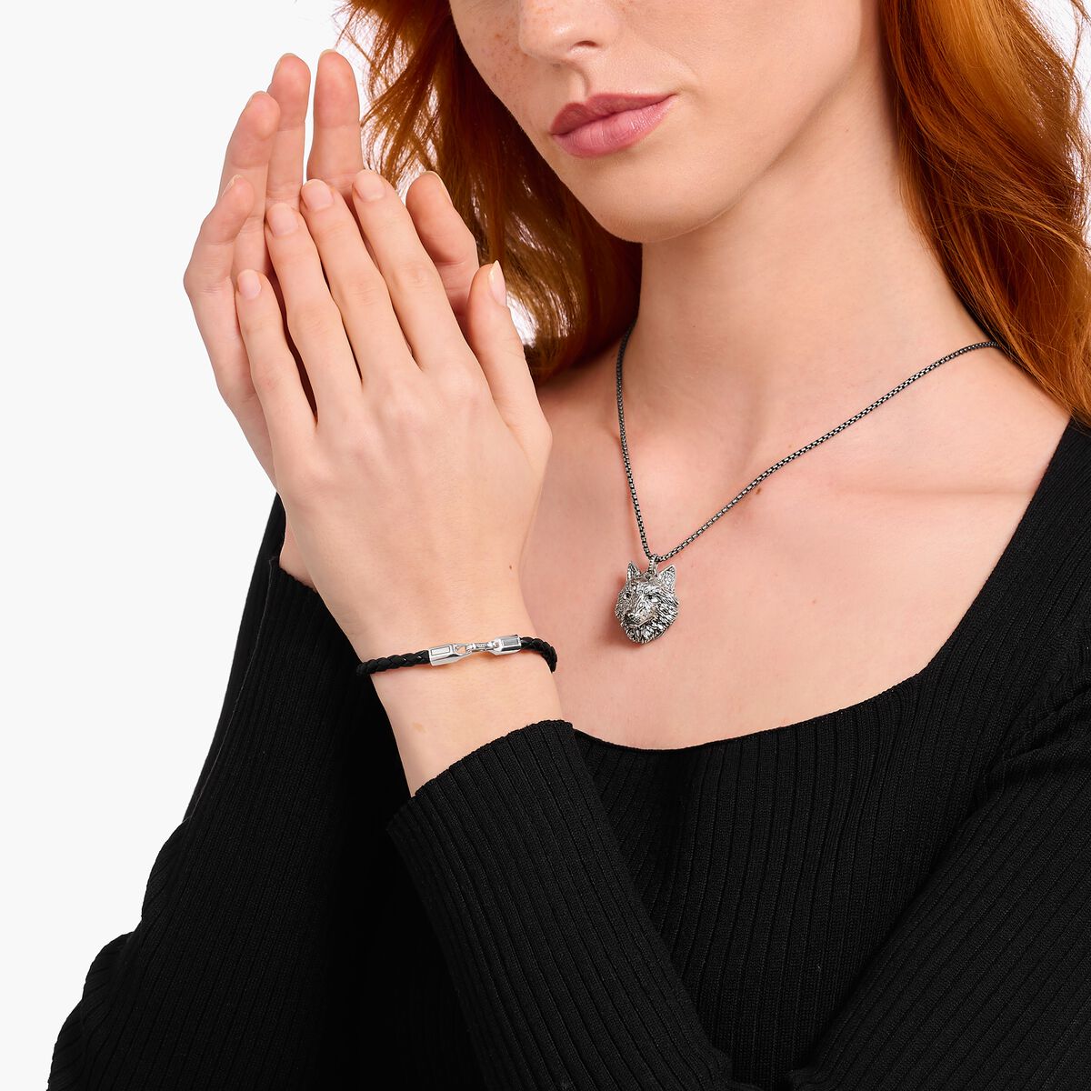 Silver bracelet with braided, black leather