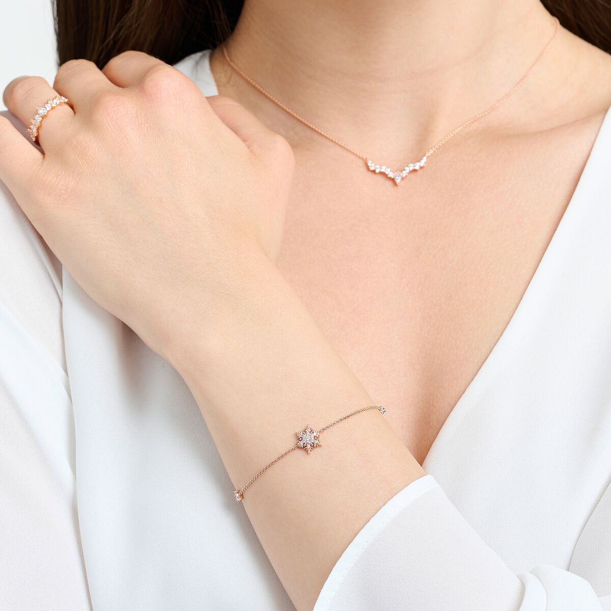 Bracelet snowflake with white stones rose gold