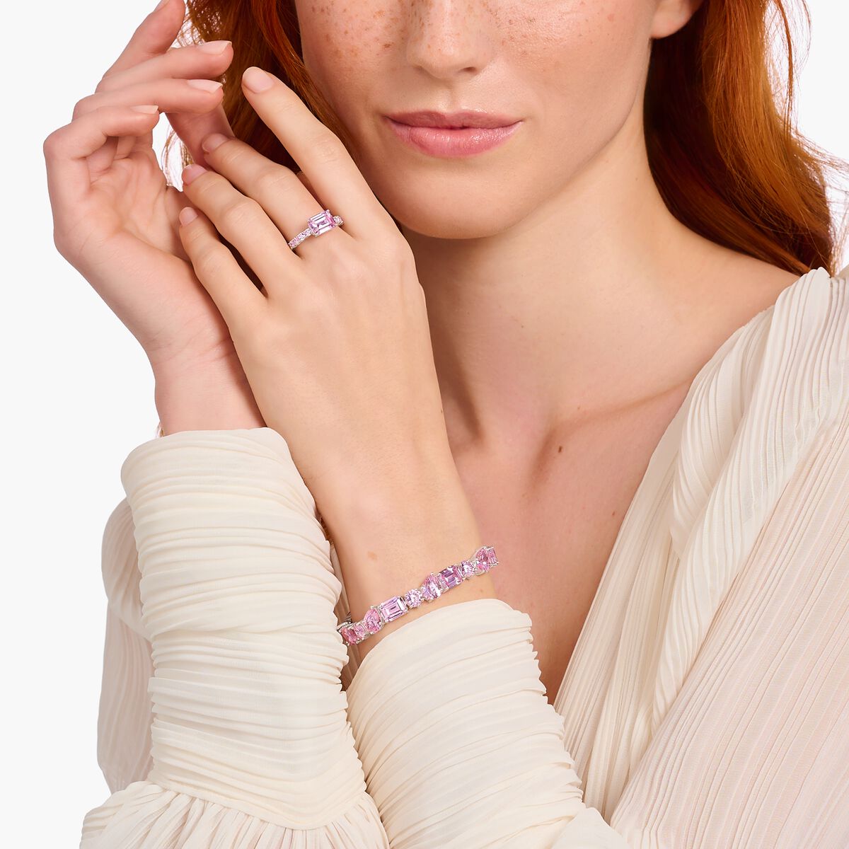 Silver solitaire ring with pink zirconia stones