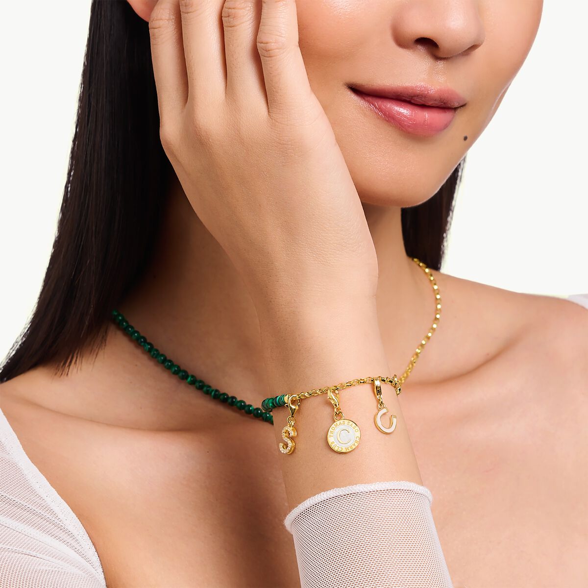 Charm bracelet with green beads yellow-gold plated