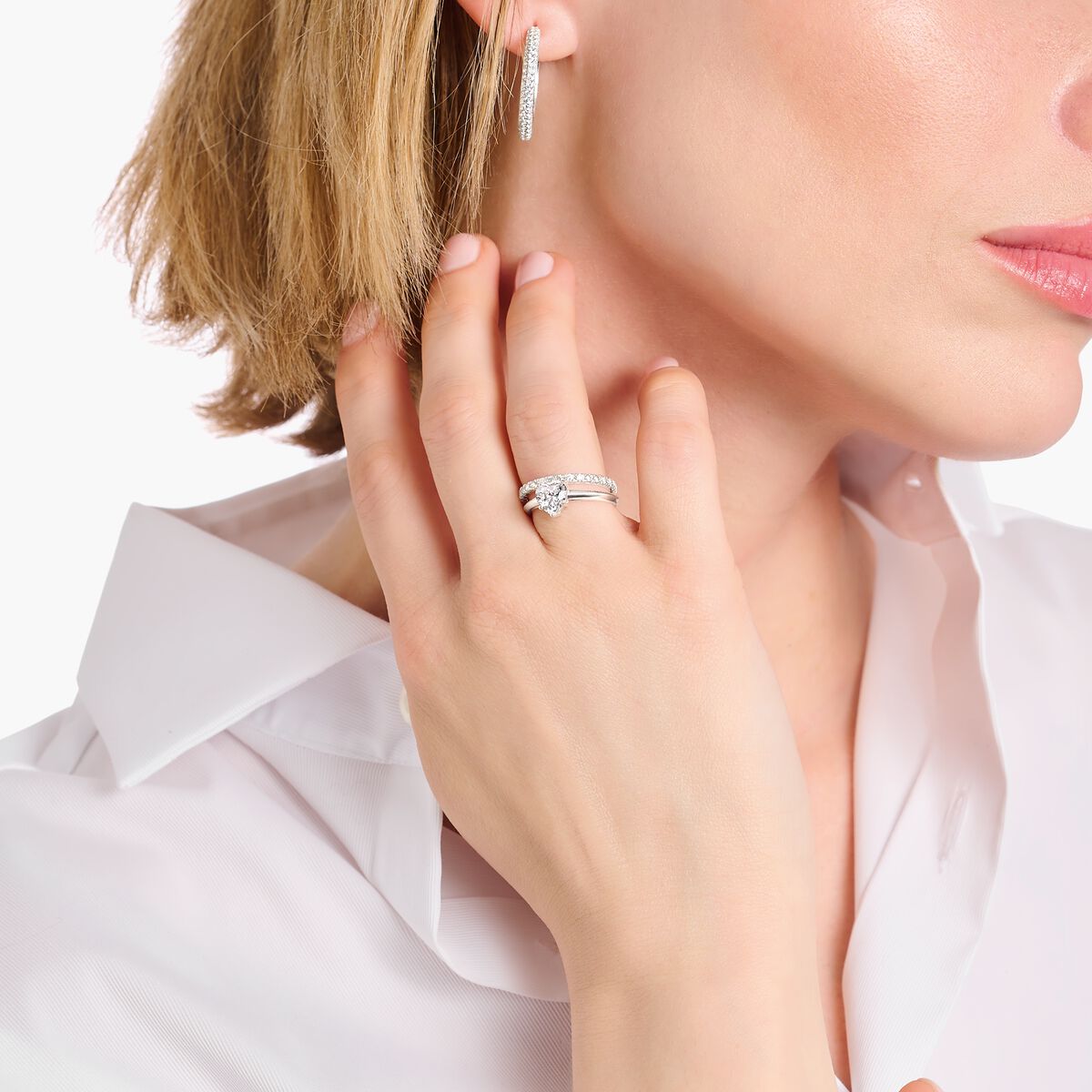 Silver ring with white, heart-shaped zirconia