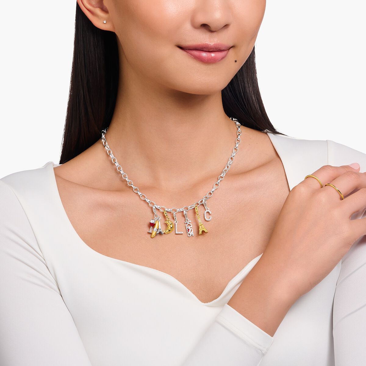 Silver charm pendant KISS with white zirconia
