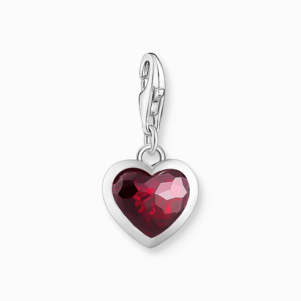 Silver charm pendant with red stone in heart-shape