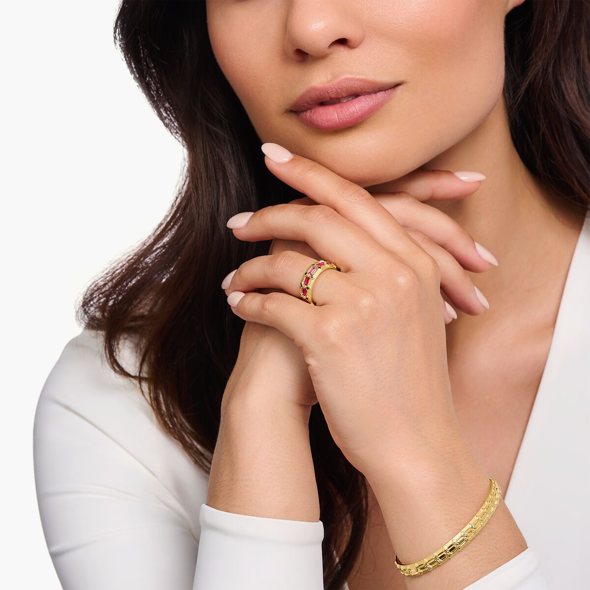 Wide gold plated ring in crocodile design with red stones