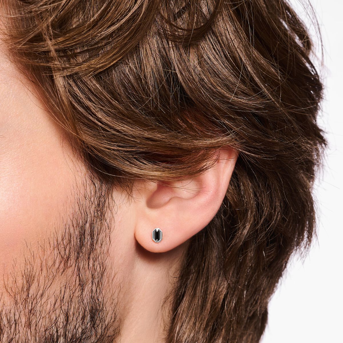 Blackened silver ear studs with crocodile eyes and black stones