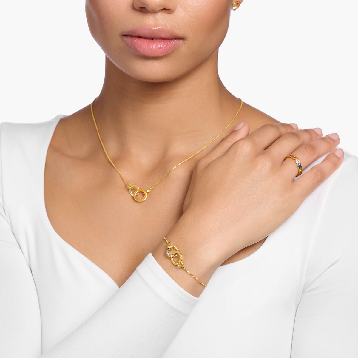 Gold plated bracelet Together with two rings and coloured stones