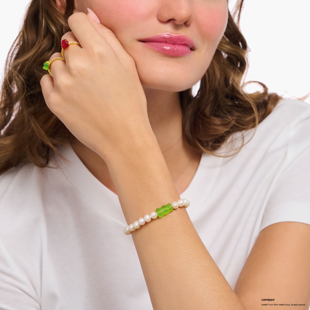 Silver pearl bracelet with green goldbears