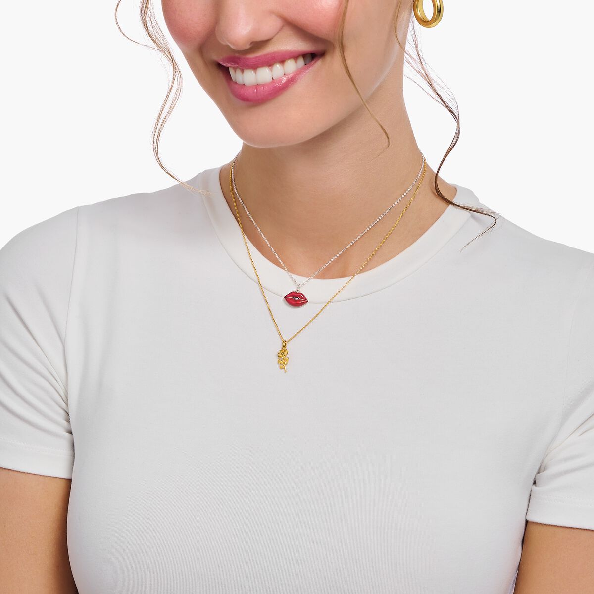 Silver necklace with red kissing mouth pendant