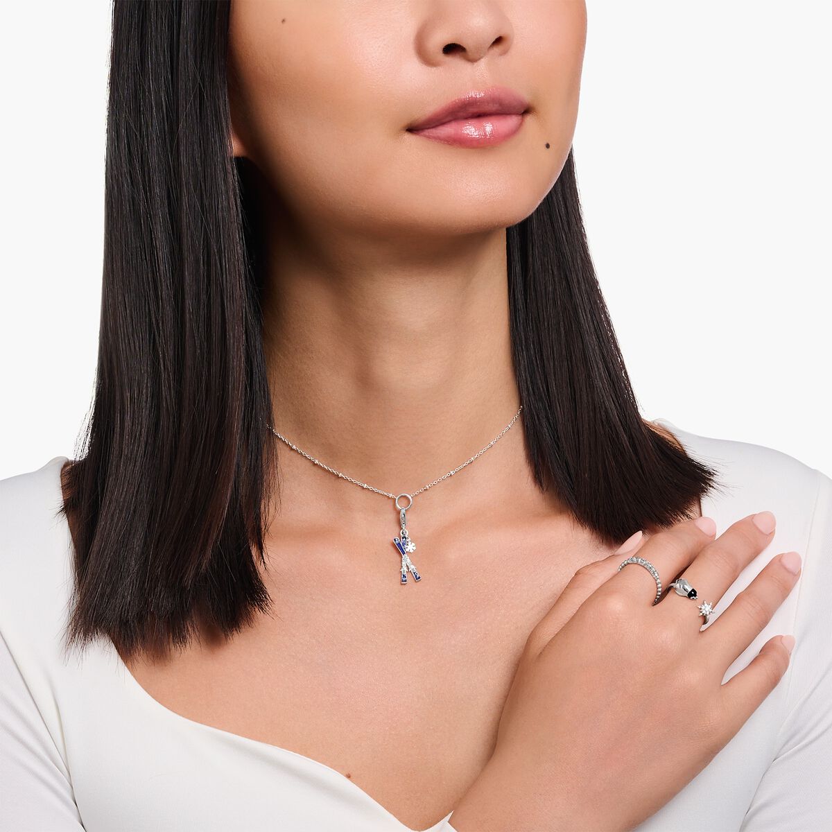 Silver charm crossed ski with cold enamel