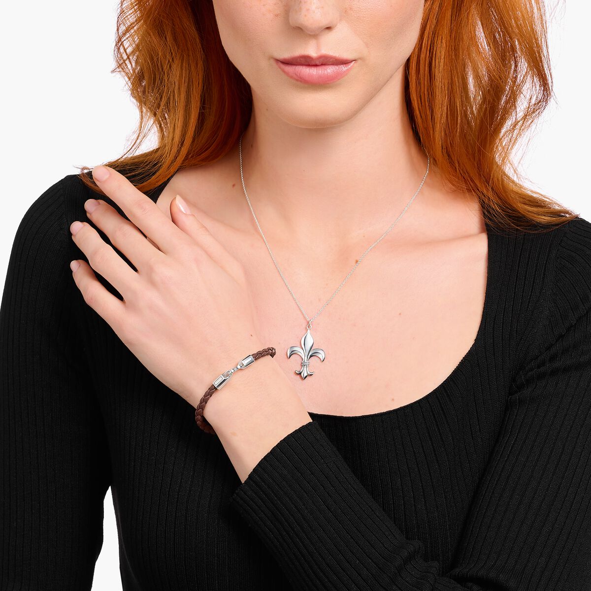 Silver bracelet with braided, brown leather