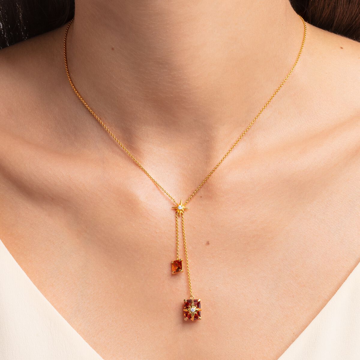 Necklace with orange stones and stars gold plated