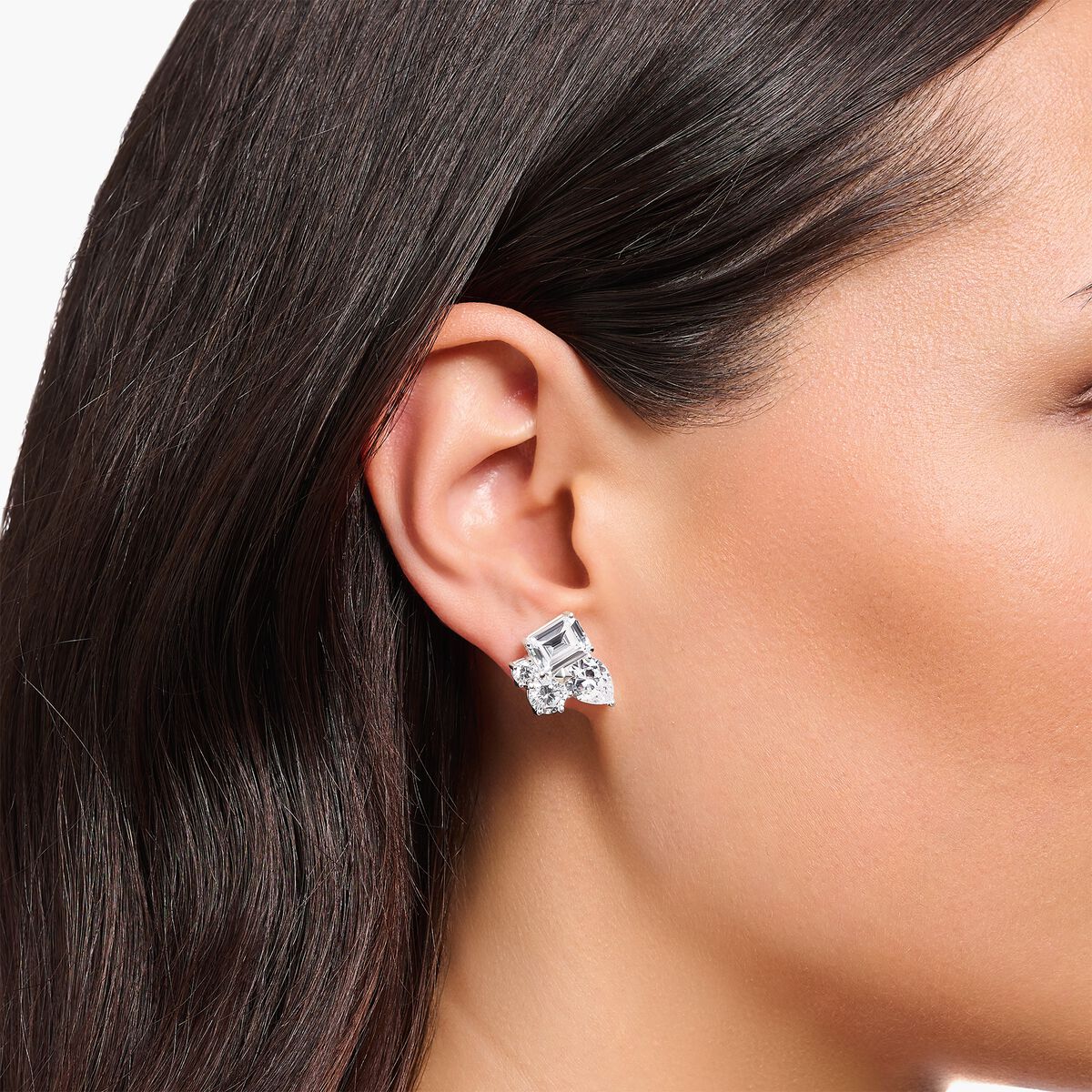 Silver ear studs with white zirconia in different sizes
