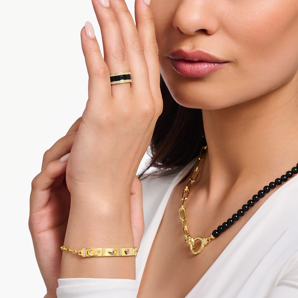 Yellow-gold plated band ring with black cold enamel and zirconia