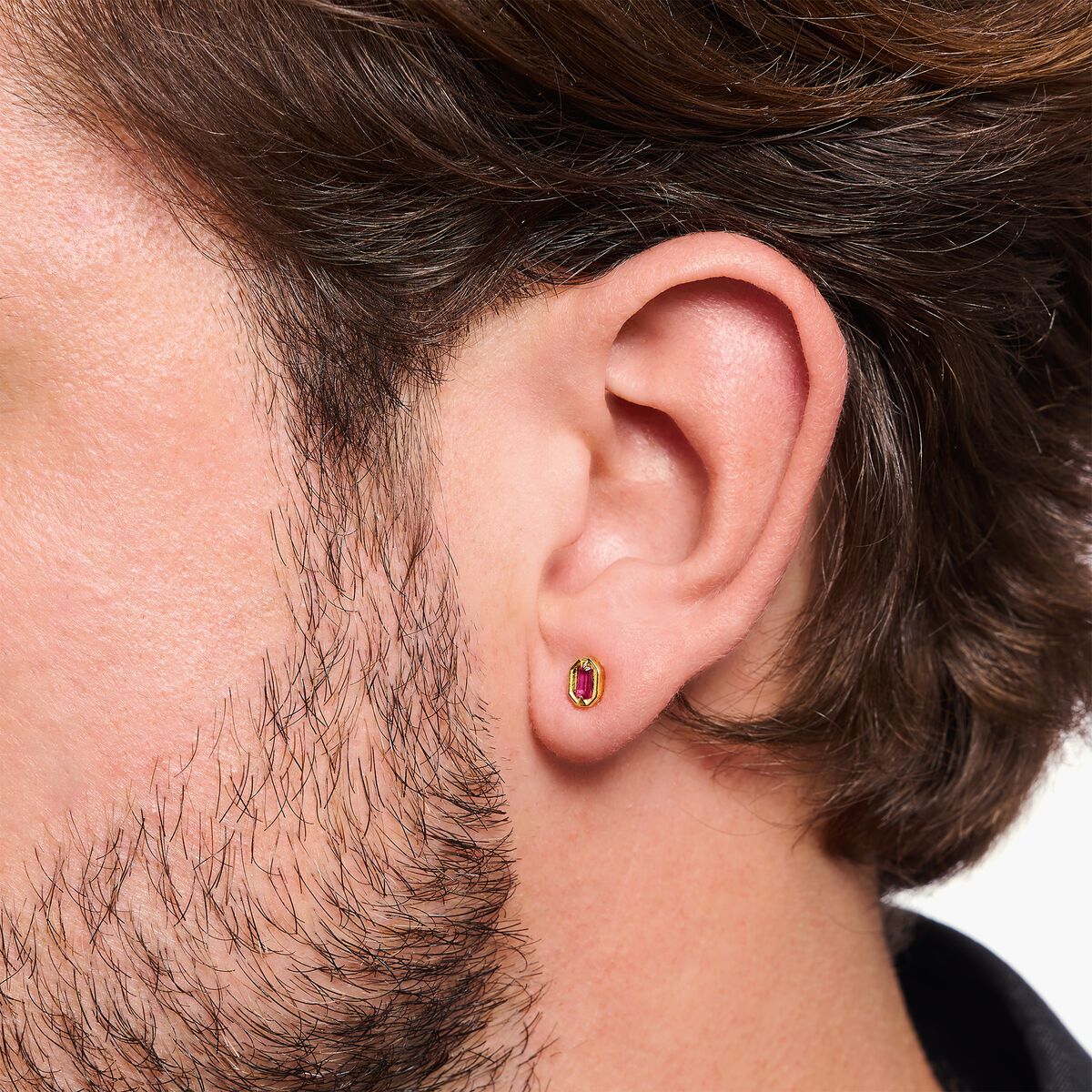 Small yellow-gold plated ear studs with red stones