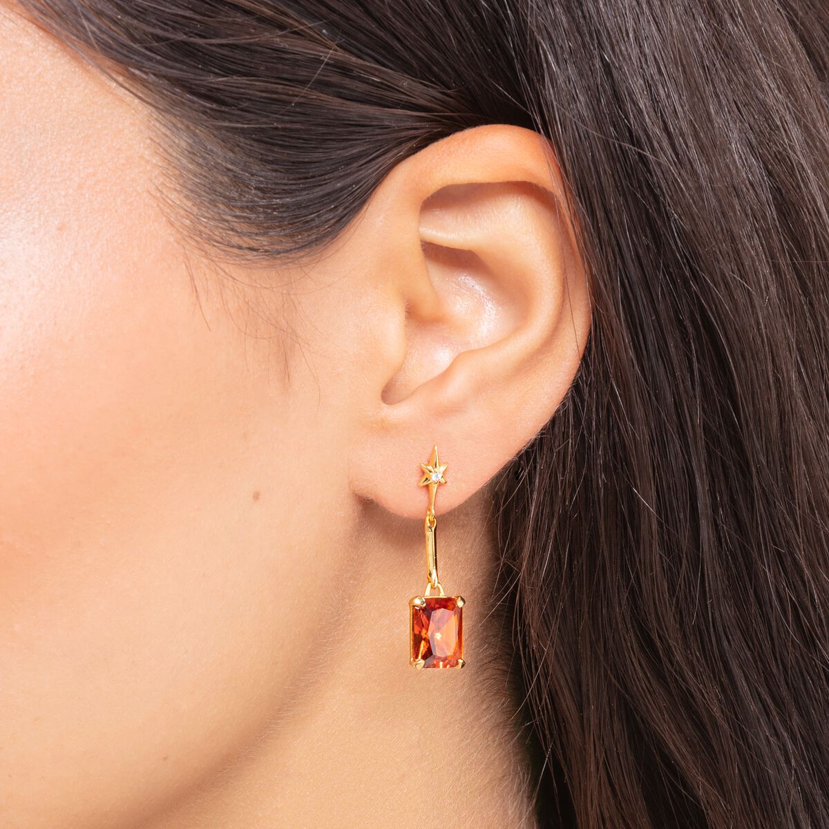 Earrings with orange stone and star gold plated