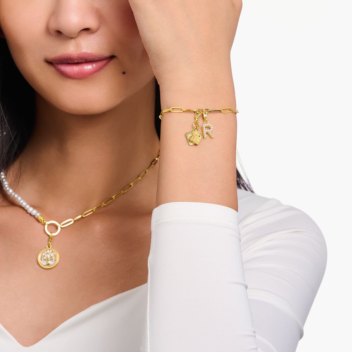 Charm pendant letter D with white stones gold plated