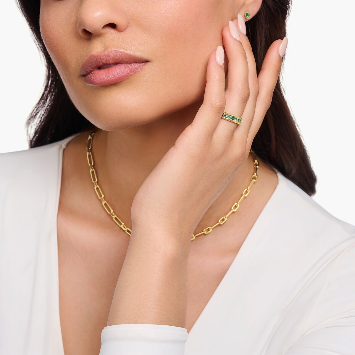 Gold plated ring in crocodile design with green stones