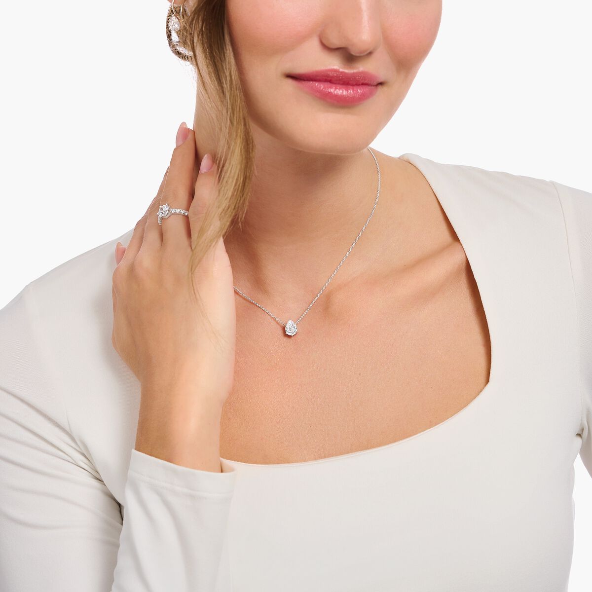 Silver necklace with white drop-shaped pendant