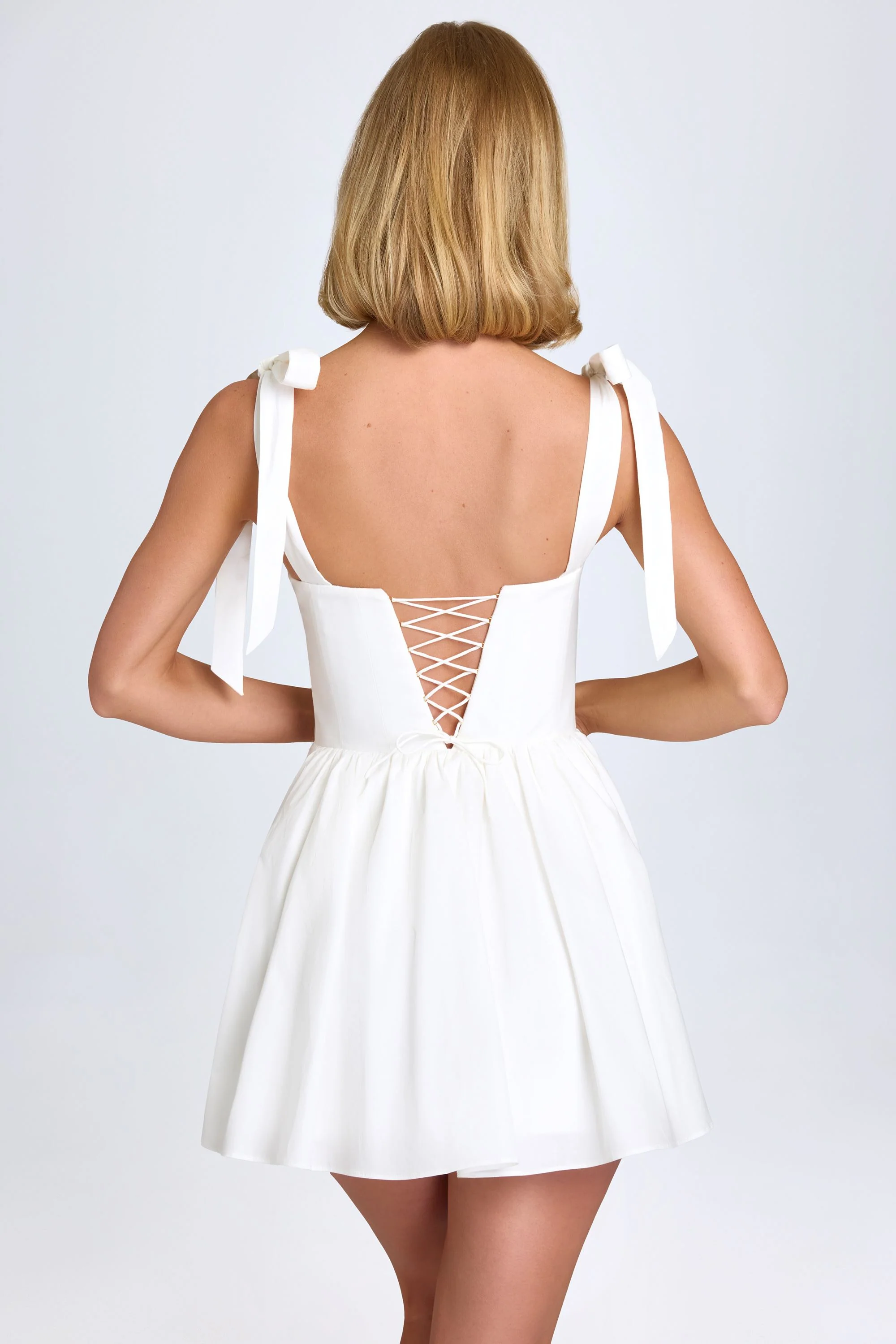 Ruched Corset Mini Dress in White - TREBLEV