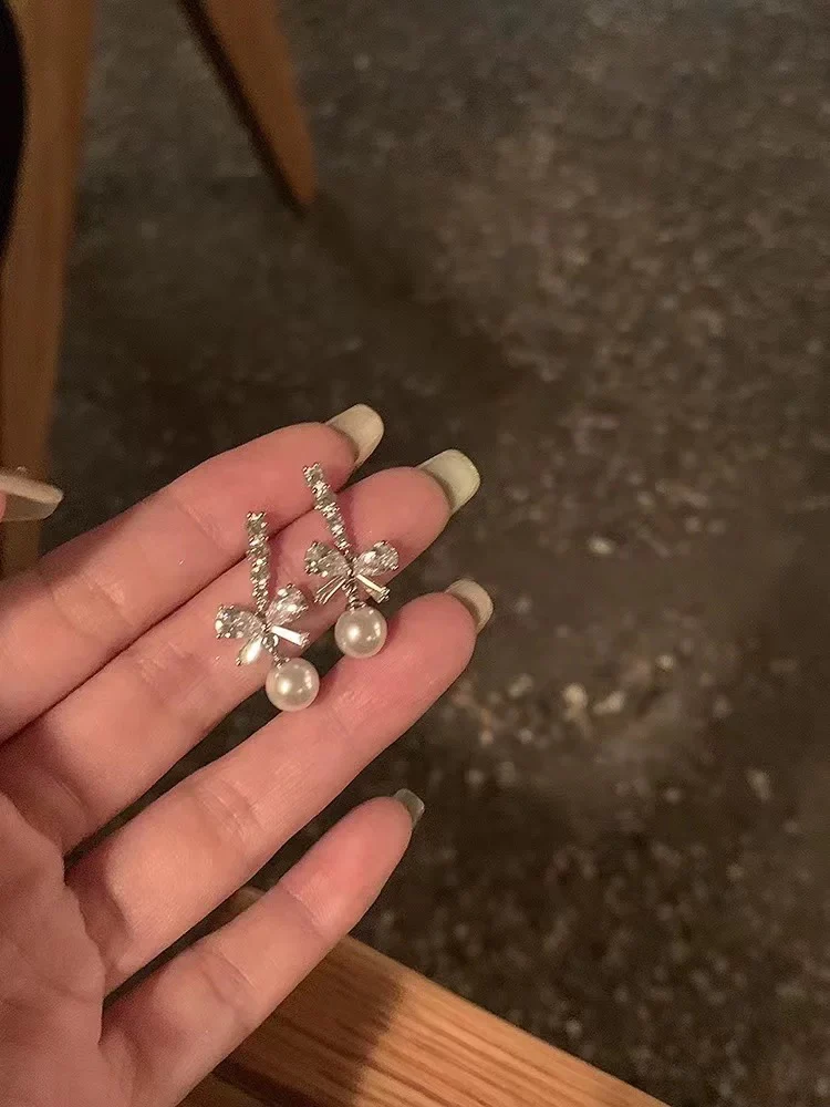 Bowknot pearl earrings 2025 new hot-selling earrings niche design high-end earrings for women without pierced ears ear clips - EHAORUI